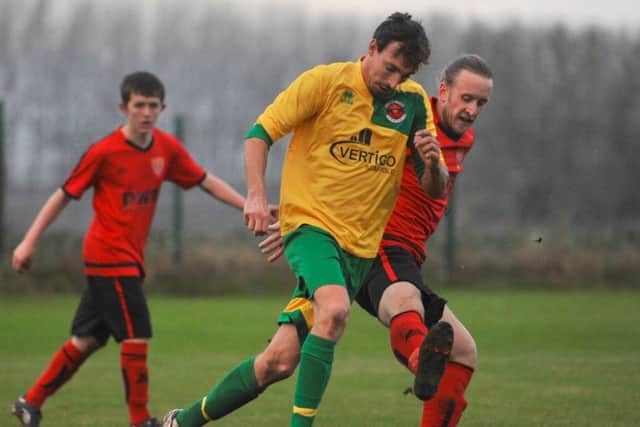 Skegness Town's man-of-the-match Ben Davison in possession against Sleaford Sports Amateurs EMN-161128-150414002