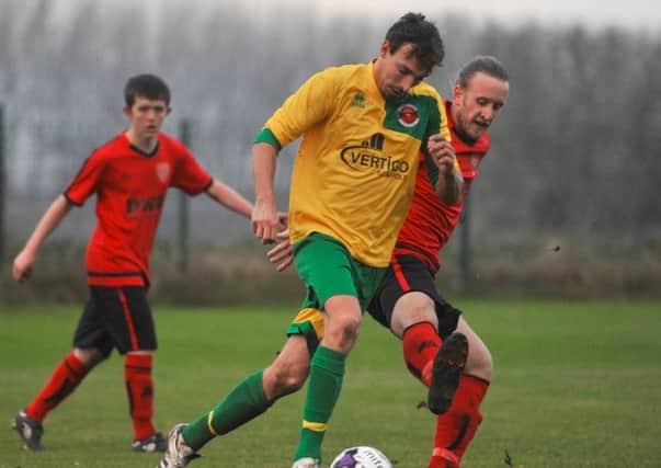 Skegness Town's man-of-the-match Ben Davison in possession against Sleaford Sports Amateurs EMN-161128-150414002