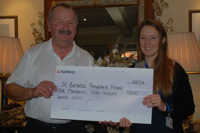 Retiring seniors captain Roger Culpin hands over his fundraising proceeds to Amy Reeve of St Barnabas Lincolnshire Hospice EMN-160212-085628002
