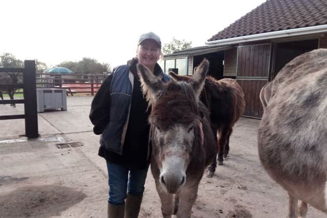 Tracy Garton with Alan at Radcliffe Donkey Sanctuary in Huttoft.