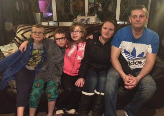 Kim and Jason Holland (right) are fighting for a place in school for their daughter Lucy (centre). Also pictured are the couples sons Ben and Hayden. ANL-160512-133030001