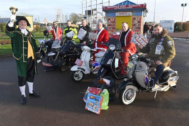 Skegness Scooter and Soul Scene set off from Skegness Clocktower to deliver presents to Pillgrim Hospital's Children's Ward. L-R Martin Peak, Phil Riches, Richard Wainwright, Dave Askew, Darren Brown and Richard Harrison. EMN-161213-110441001