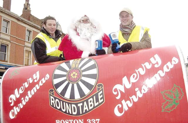 Santa on the Boston Round Table sleigh in December 2006 with helpers Chris Hazelwood (left) and Andy Stratton.