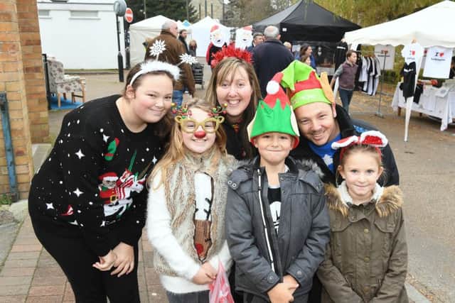 Ruskington Christmas Market. L-R Chloe Vickers 13, Grace Vickers 8, Lisa Vickers, Archie Nadin 8, Wayne Vickers, Brooke Nadin 7. EMN-160512-104000001
