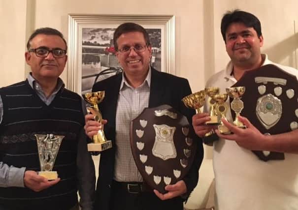 Pictured, from left, are Khawar Naeem (best bowler), Zubair Ahmed (skipper of the Division One Cup-winning side) and Imran Cheema (league player of the year).