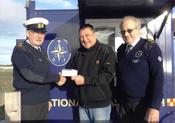 Cheque presentation to National Coastwatch Institution Skegness from St Clement Lodge.