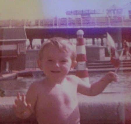 Matthew Sloan on holiday with his treasured windmill. ANL-160612-083647001