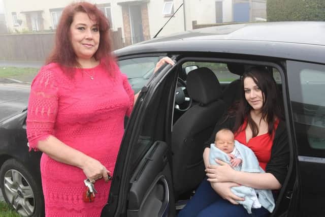 Grandma Nicky Dyer.(left) with mum Terri Dyer and baby Aaron in the car in which he was born. Photo: MSKP-061216-24 ANL-160612-105811001