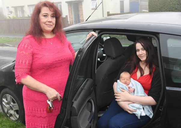 Grandma Nicky Dyer.(left) with mum Terri Dyer and baby Aaron in the car in which he was born. Photo: MSKP-061216-24 ANL-160612-105811001