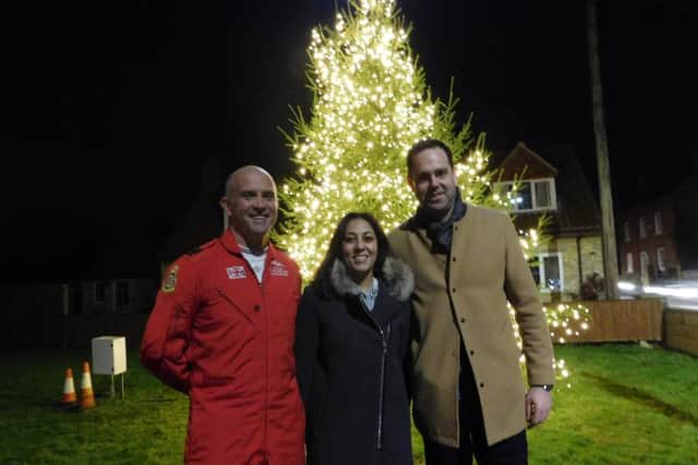 All lit up. @red 10' Squadron Leader Mike Ling with Navenby and Cliff Villages Business Network co-chairmen Mindy Arora and Luke Daniels at the Christmas shopping switch-on event. EMN-160912-141943001