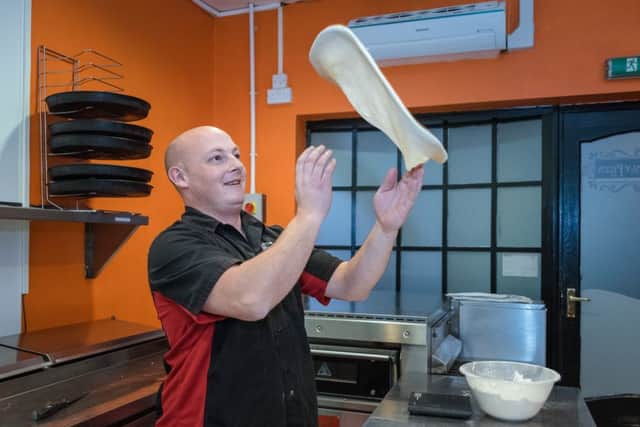 James Broderick from Little Italy Pizza Co in action making pizza bases EMN-161213-131848001