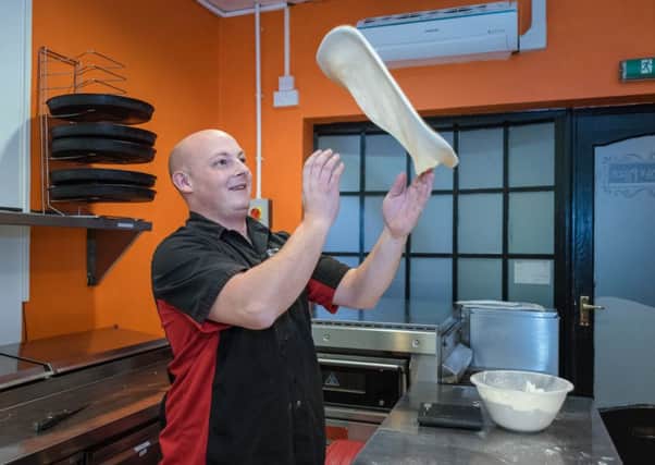 James Broderick from Little Italy Pizza Co in action making pizza bases EMN-161213-131848001