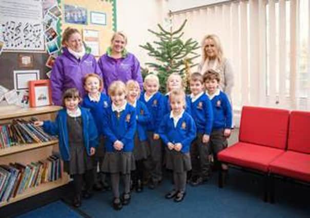 Scamblesby Primary School with their tree.