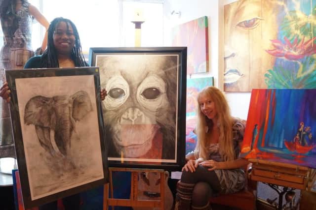 Gallery owners Anita, left, and Erica with some of their workAnita and Erica EMN-160712-143310001