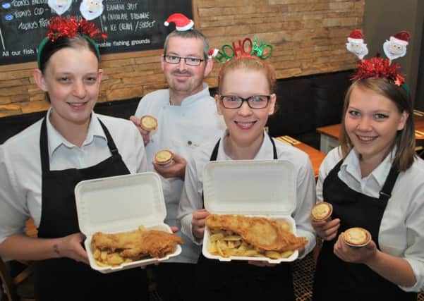 Elite Fish and Chip Company staff at Sleaford keen to get a full house for their Christmas fundraiser. EMN-160712-162555001