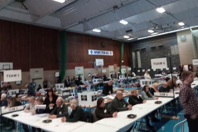 Voting papers are being scrutinized as the first ballot boxes arrive at the North Kesteven Sports Centre - now known as One NK. EMN-160812-223415001