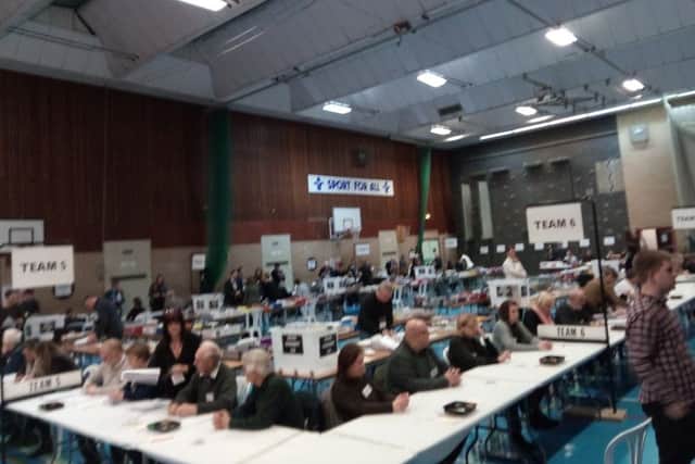 Voting papers are being scrutinized as the first ballot boxes arrive at the North Kesteven Sports Centre - now known as One NK. EMN-160812-223415001