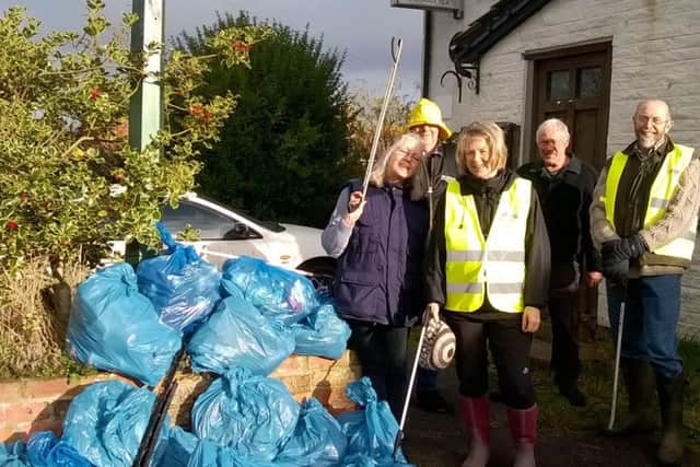 Tetford volunteers get to grips with the tidy up EMN-160912-142607001