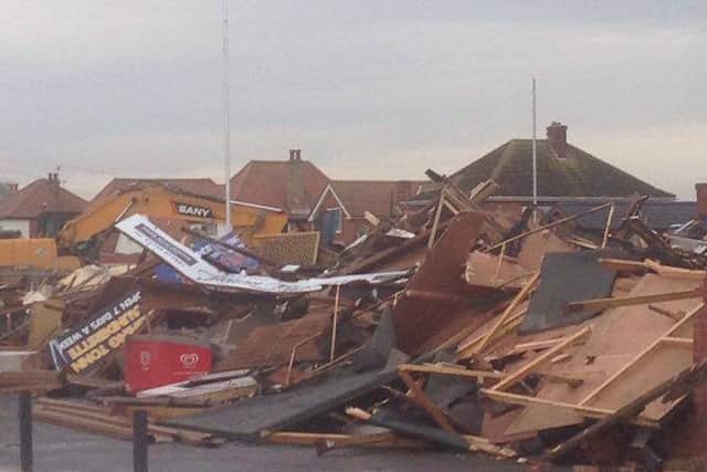 The digger completes the demolition of the Sea Lane Hotel at Ingoldmells. Photo: Dawn Smith EMN-161012-155925001