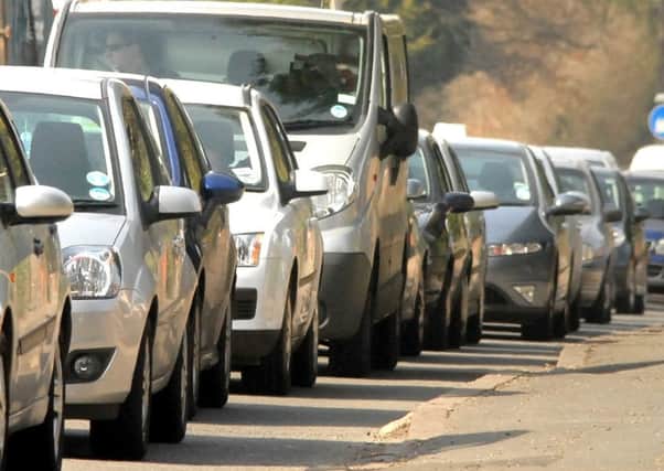 Could a new joint approach between a district council and the county council lead to an end to traffic snarl-ups like this in Wragby?