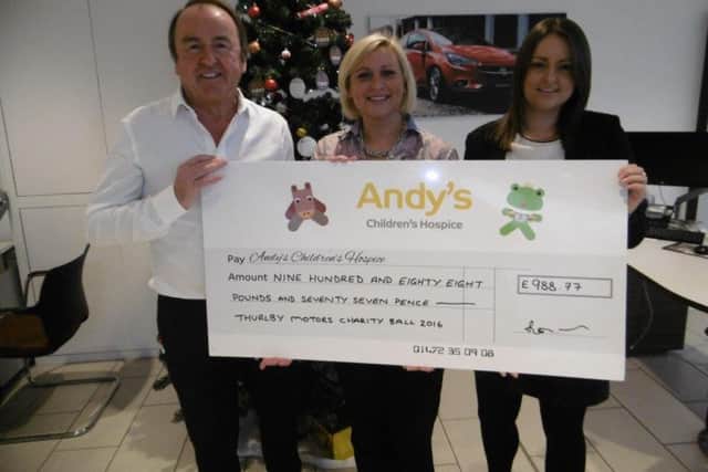 Thurlby Motors raised more than £900 for Andy's Children's Hospice EMN-161215-163523001