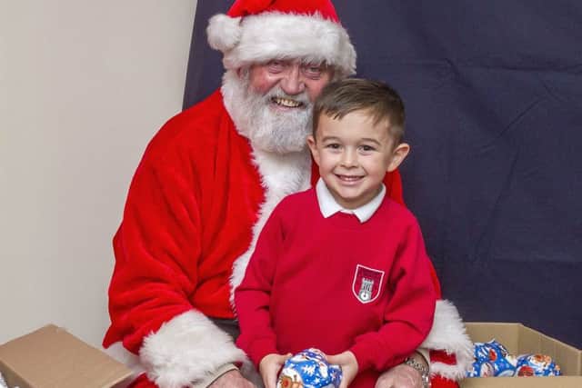 5-year-old Dillon Bonner was first to visit Santa at Coningsby School Xmas Fayre. Photo by Oscarpix Imaging. EMN-161212-074803001