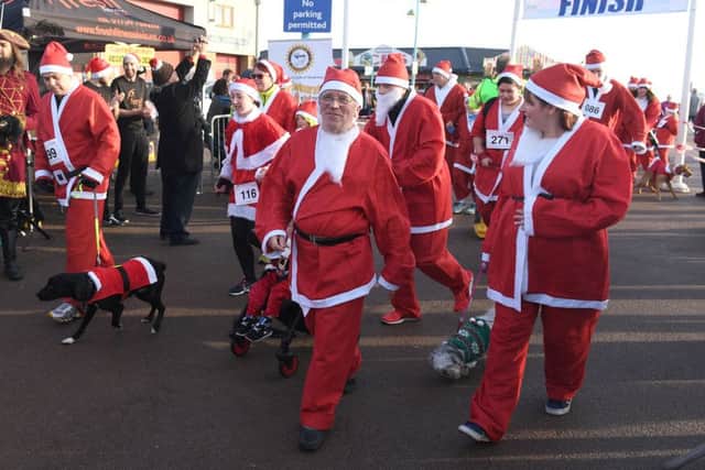 Walkies time for dogs and owners at the Skegness Santa Run. Photo: MSKP-111216-38 ANL-161212-101312001