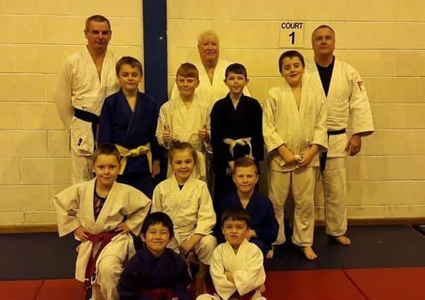 The judokas celebrate siccessful gradings.