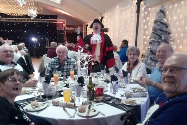 The town crier welcomes guests to one of the parties for the elderly being held at the Grosvenor House Hotel in Skegness. ANL-161212-135629001