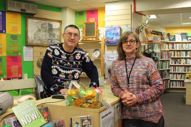 Oxfam volunteer Mark Humphries with interim manager Alison Moore.