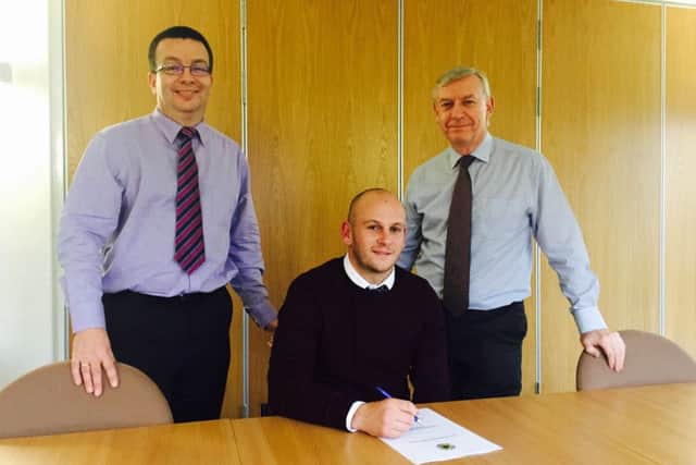 Adam Murray, with Pilgrims chairman David Newton and vice-chairman Neil Kempster.