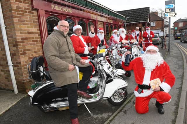 Members of Sleaford All-Knighters scooter club delivering donated mince pies, rum truffles and sherry to Roxholm Care Home. Front right - Rob Castle. EMN-161219-110935001