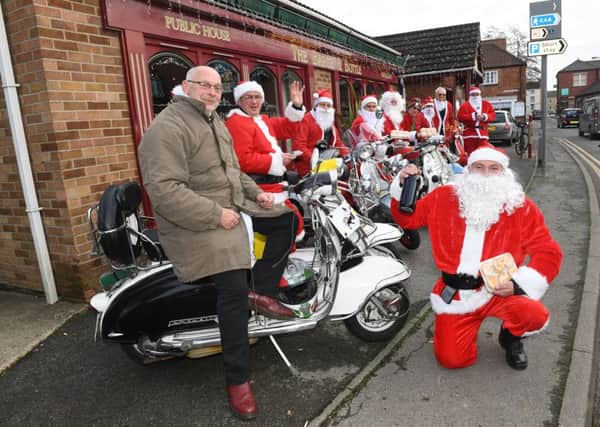 Members of Sleaford All-Knighters scooter club delivering donated mince pies, rum truffles and sherry to Roxholm Care Home. Front right - Rob Castle. EMN-161219-110935001