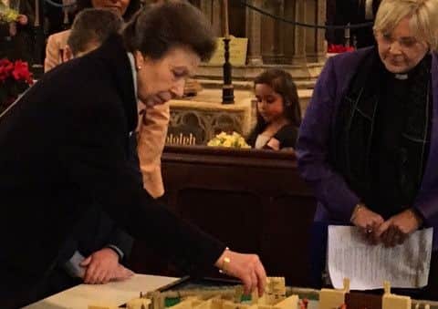 Princess Anne putting a brick onto a lego model of The Stump EMN-161215-142654001