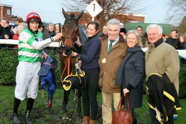 Last years Clugston Lincolnshire National winner West of the Edge with jockey James Banks and trainer Dai Evans (right) and connections EMN-161215-145918002