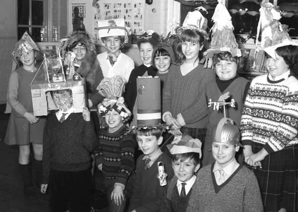 Children at Park School, in Boston, show off their handmade party hats in December 1966.