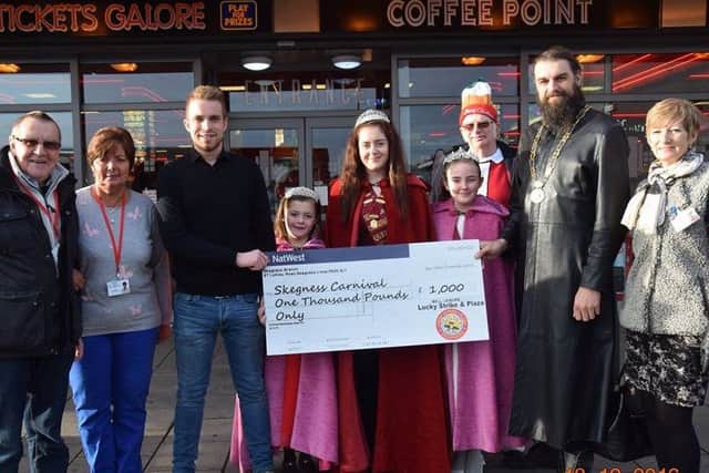 Bell Leisure present Skegness Carnival with a cheque for ?1,000. Photo: Barry Robinson. ANL-161220-143305001 ANL-161220-143305001