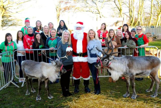 Santa and his reindeer pictured with staff at Little Learners Nursery School.