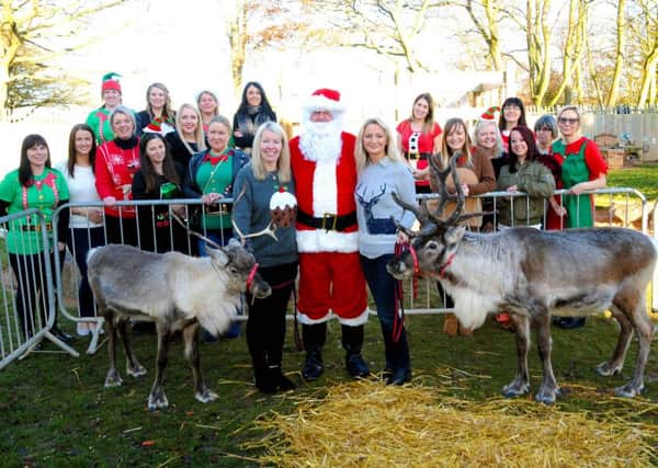 Santa and his reindeer pictured with staff at Little Learners Nursery School.
