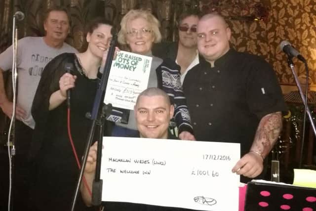 Clare Chrysostomou, sister of Lee (left), Shirley Atherton, Lee Croft (centre), and Jack Howe with members of Dr Frankenfish.