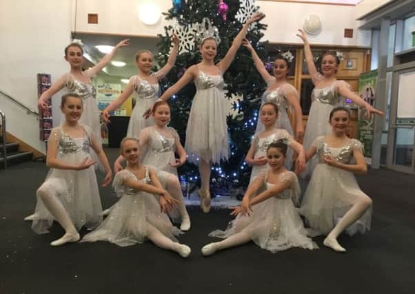 Snow ballet performers in their sparkling costumes ready for the show. EMN-161221-165207001