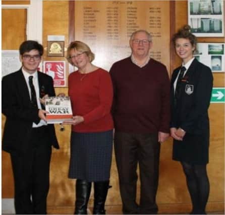 Colin Gascoyne & Mary Silverton, authors of the book, Horncastle's Great War- were pleased to present a copy  to Phoebe Merritt and Gui Freitas, head boy and head girl of Queen Elizabeth Grammar School.