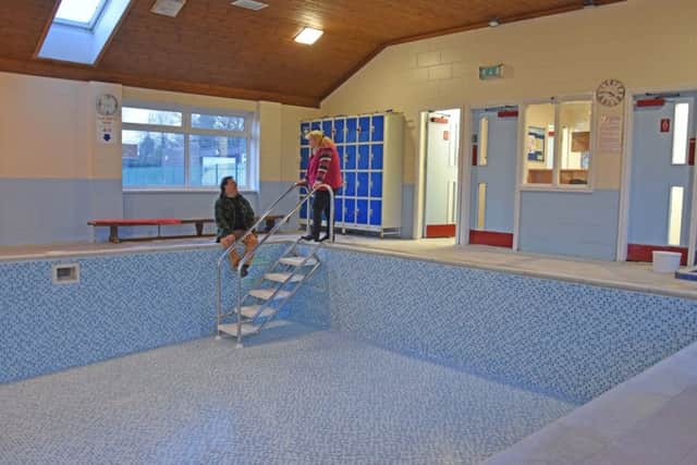 Sitting at the pool is Tim Langdale-Smith pool chairman, with pool manager Davina Ness. EMN-161221-093250001
