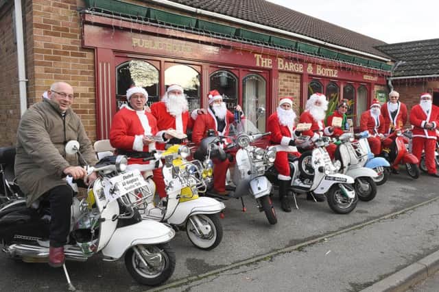 Members of Sleaford All-Knighters scooter club delivering donated mince pies, rum truffles and sherry to Roxholm Care Home. EMN-161219-110922001