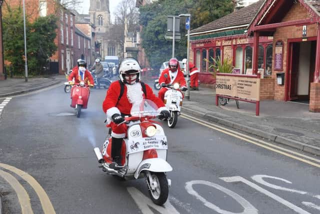 Members of Sleaford All-Knighters scooter club delivering donated mince pies, rum truffles and sherry to Roxholm Care Home. EMN-161219-110858001