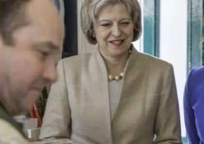Victoria Atkins with Theresa May.