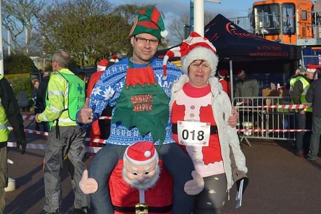 Carl and Lisa get into the spirit of things at the Skegness Santa Fun Run EMN-161219-120158002