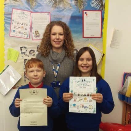Morgan Davies (9) and Daisy Brown (10) with Miss Wilson.