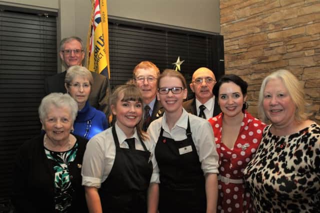Georgia and Rachel Tweedale with Heather Marie and members of the Sleaford branch of Royal British Legion celebrate reaching their target. EMN-161220-165541001