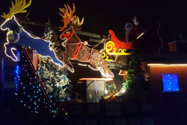 Santa aboard the Sleaford fire service sleigh touring the streets over the last couple of weeks for charity. EMN-161221-114843001